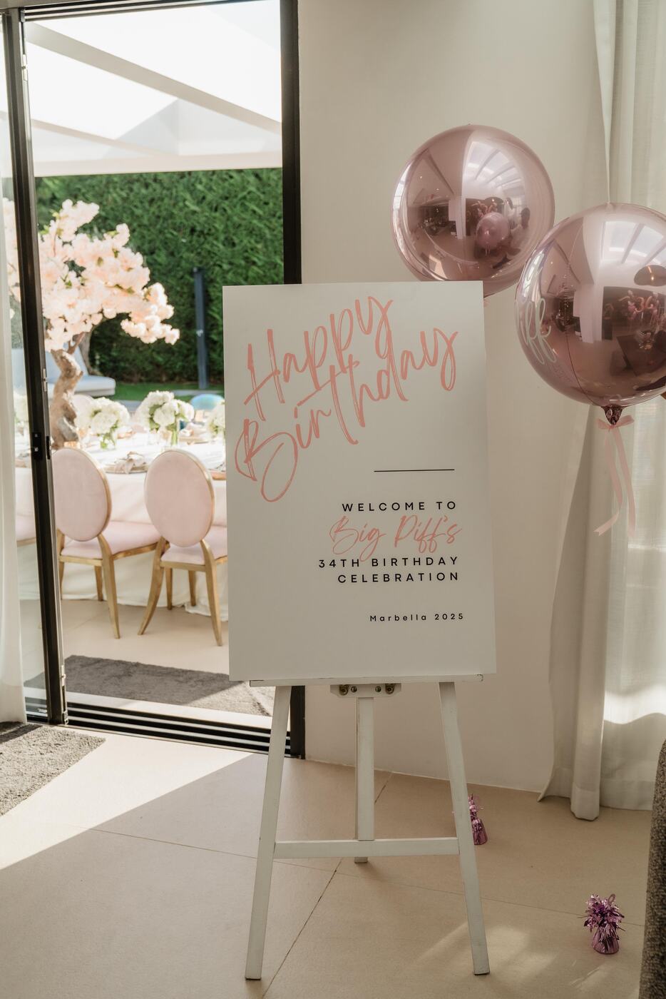 Happy Birthday welcome sign with personalised pink orb balloons, Marbella villa birthday